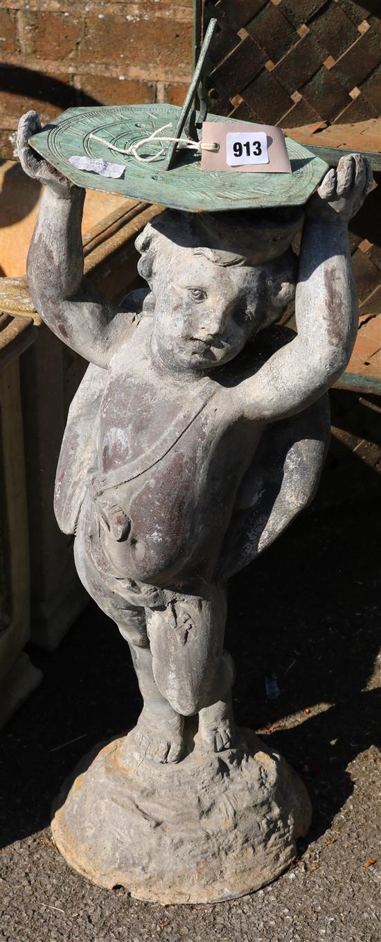 Lead figure of putti and sun dial(-)